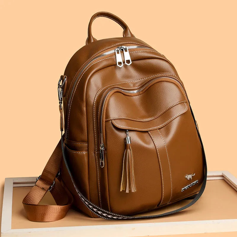 Genuine leather hand-held tassel backpack in khaki with stitching and fringe detail