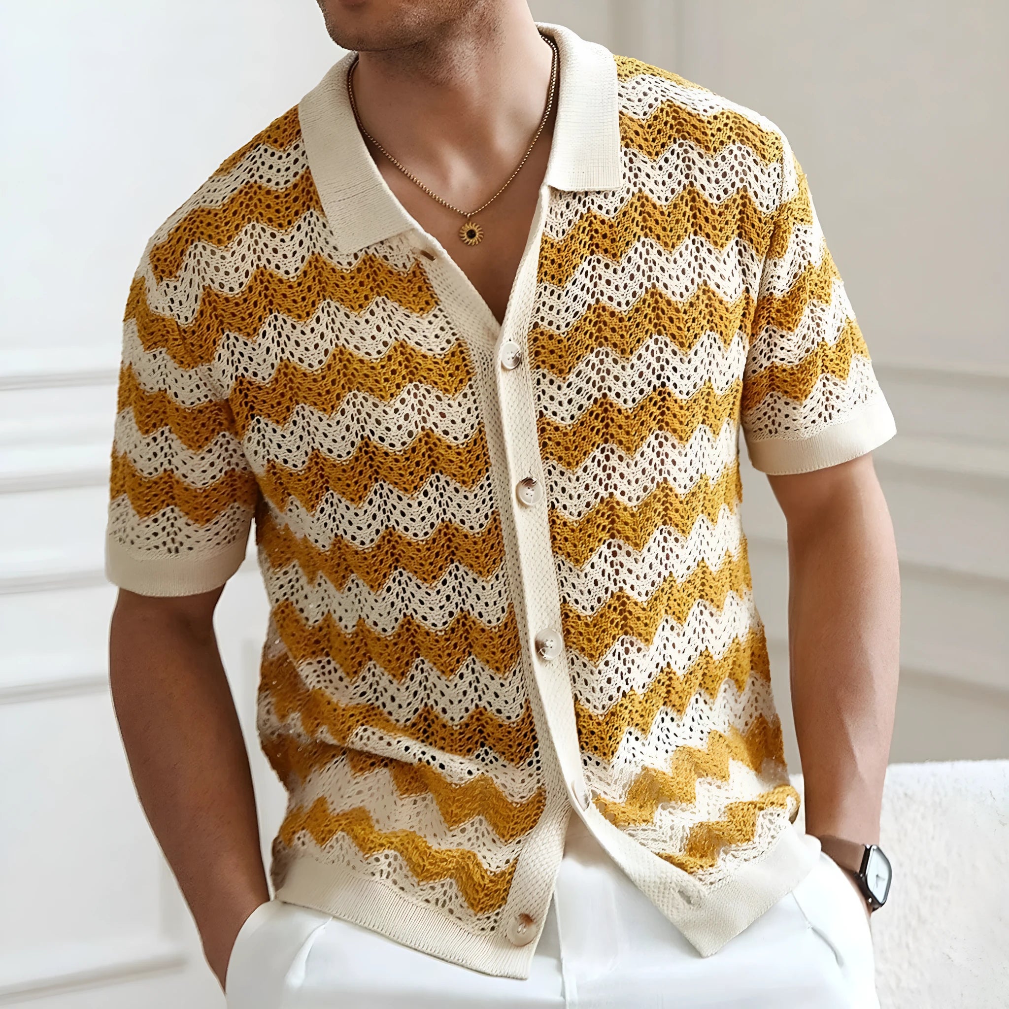 Man's short-sleeve blue sweater with a textured corduroy-like jacquard pattern, showing detail of the fabric weave.