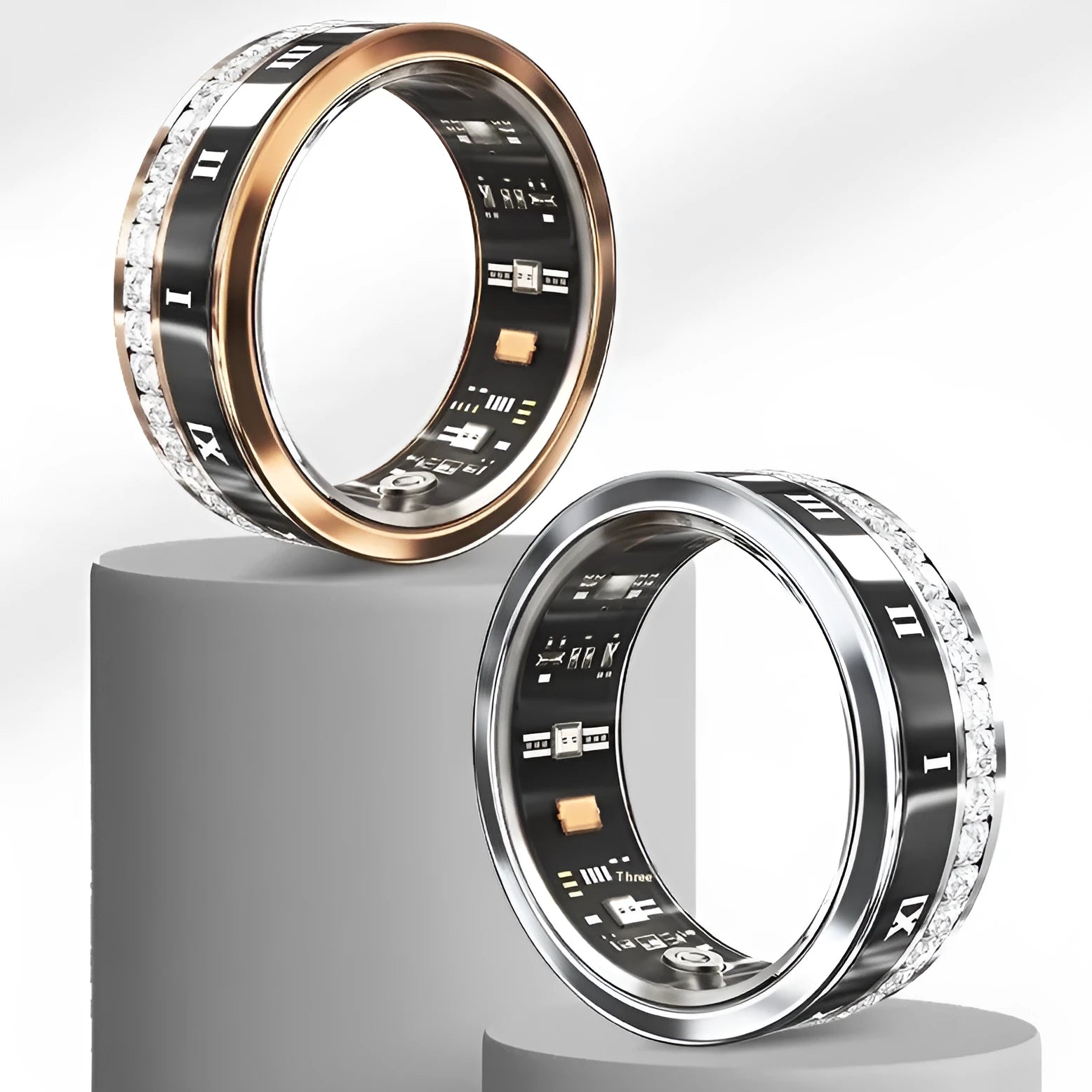 Silver and gold diamond smart rings for blood oxygen monitoring on a finger