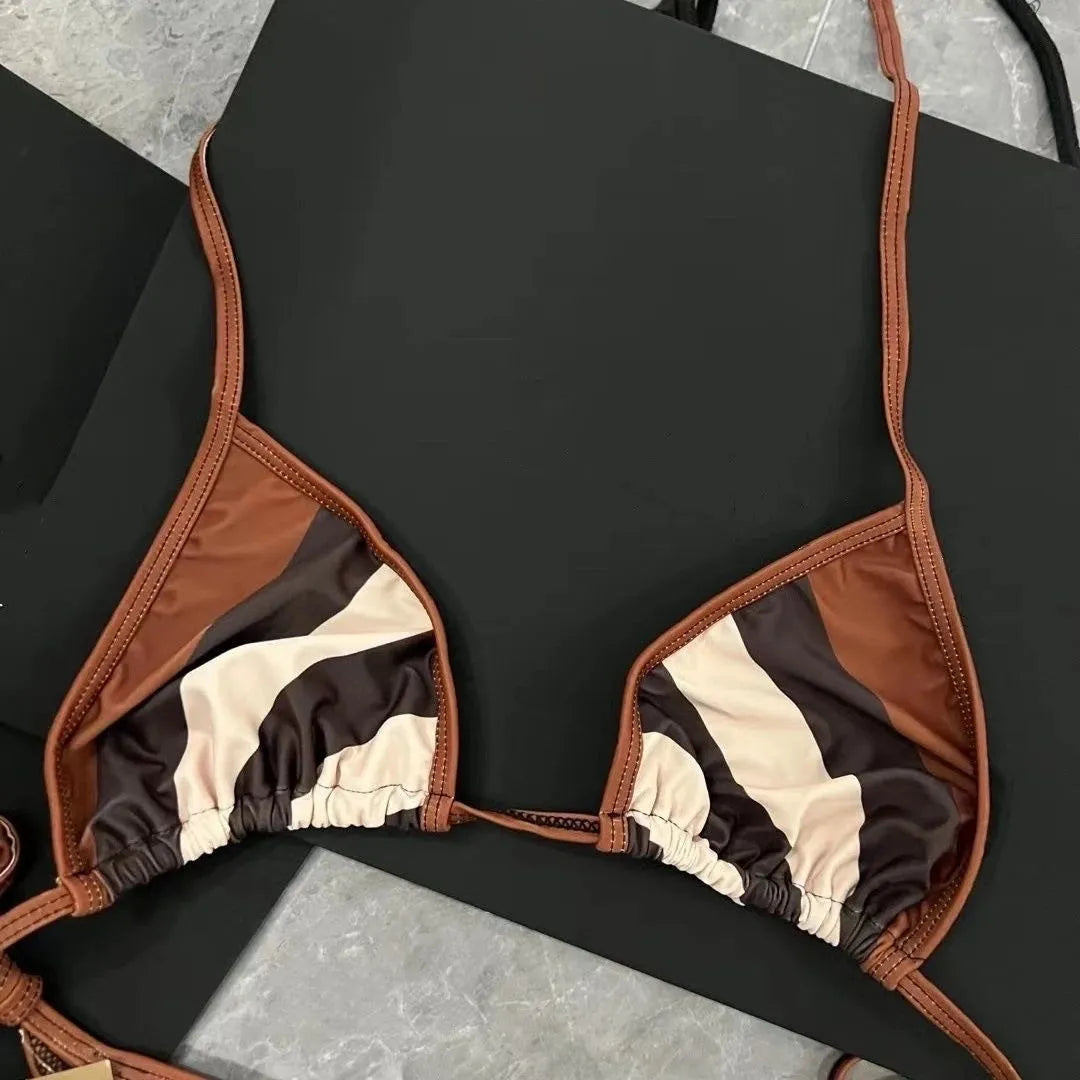 Women's black and white floral bikini set with briefs style bottoms in polyester for summer swimming