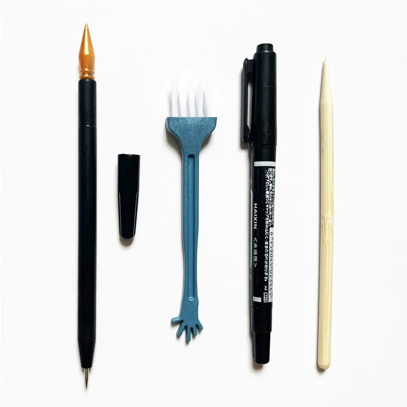 Scratch art tool set with scraper pen, brush, bamboo stick, and repair liquid bottle.