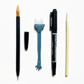 Scratch art tool set with scraper pen, brush, bamboo stick, and repair liquid bottle.
