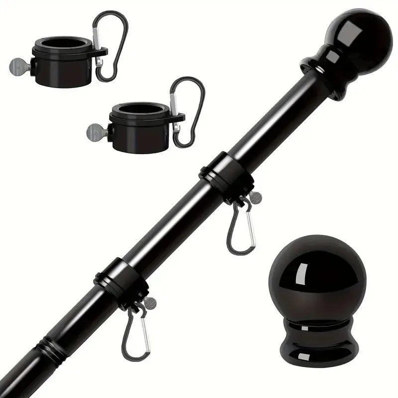 Wall mounted stainless steel sectional flagpole in black finish on a brick wall