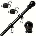 Wall mounted stainless steel sectional flagpole in black finish on a brick wall
