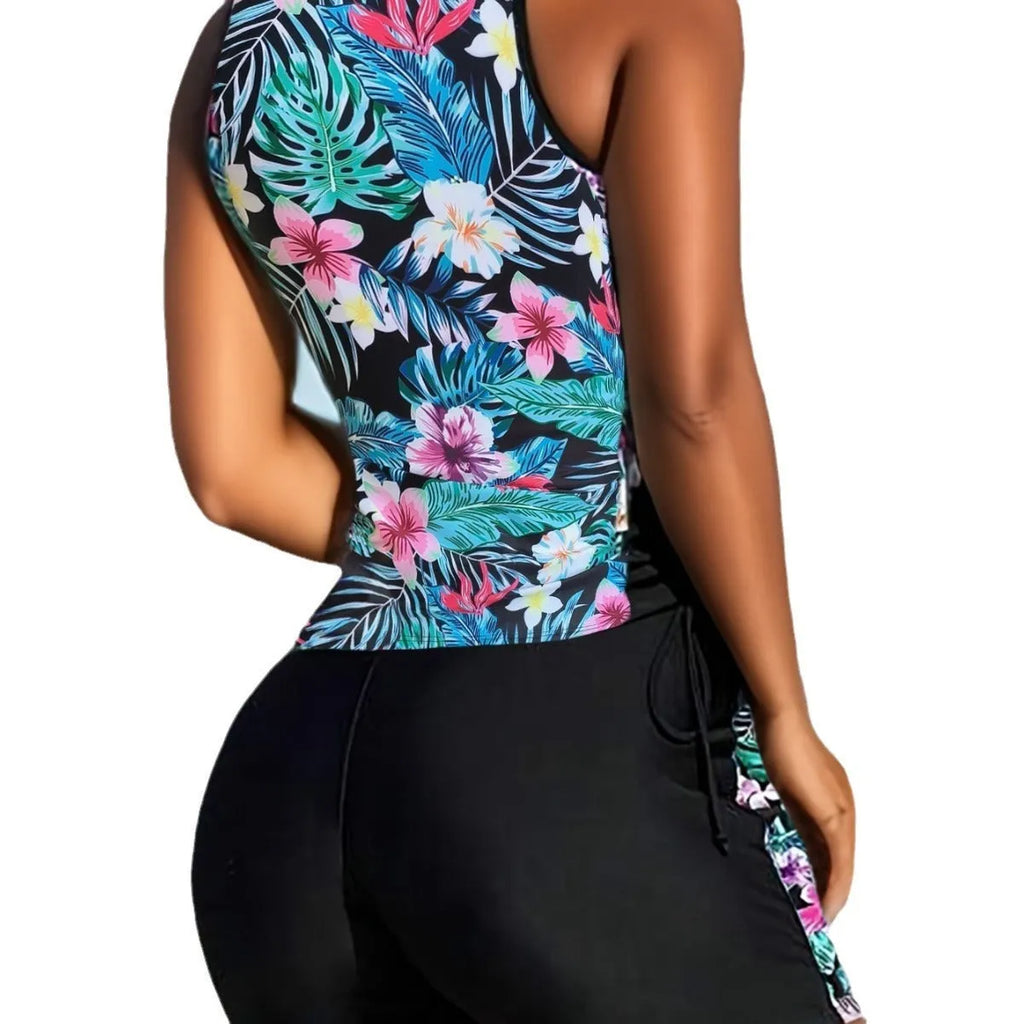 Women's plus size floral high-waist swim bikini in blue on a neutral background.