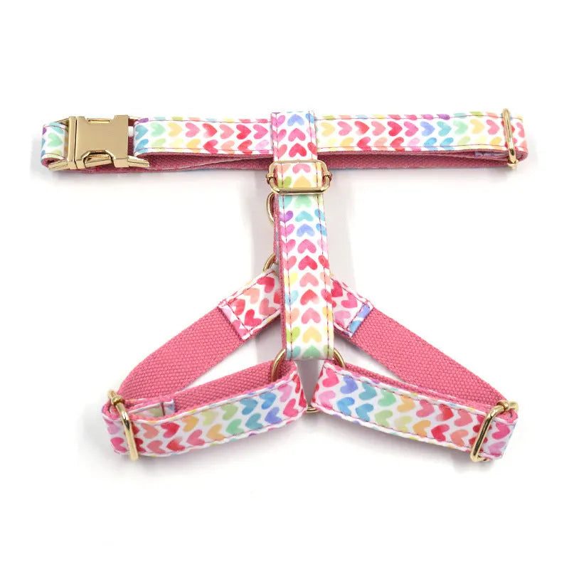 Pink dog harness with gold buckle and colourful heart-shaped crystals for small dogs