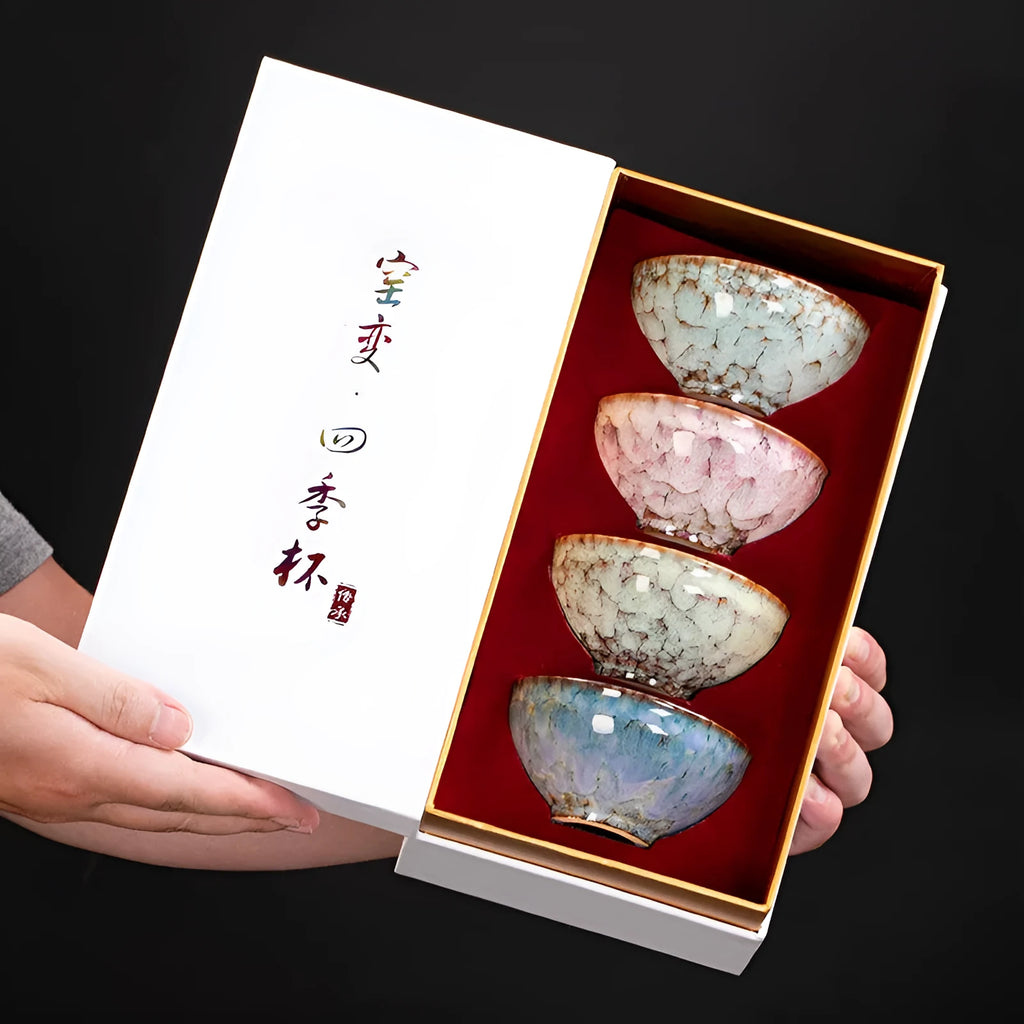 Ceramic Kung Fu tea cup set with four cups in a light-coloured new Chinese style gift box.