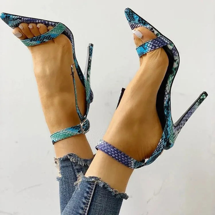 Blue women's high heel sandals with cut-out details and a buckle strap, shown in a large size.