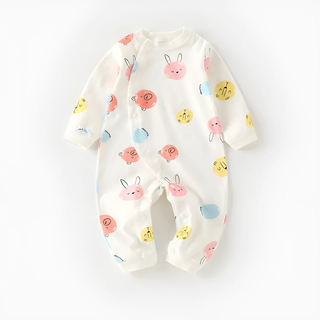 Cotton baby pajamas in cartoon dragon print for a newborn infant.