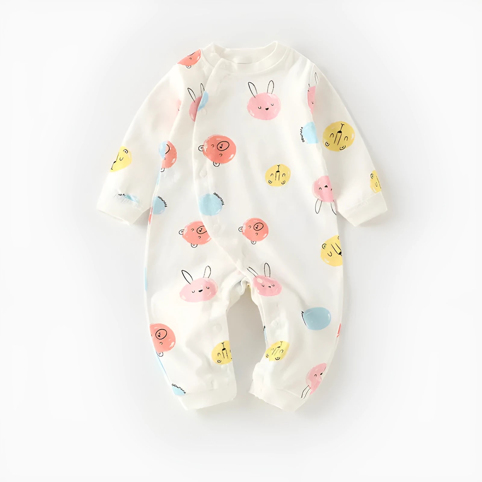 Cotton baby pajamas in cartoon dragon print for a newborn infant.