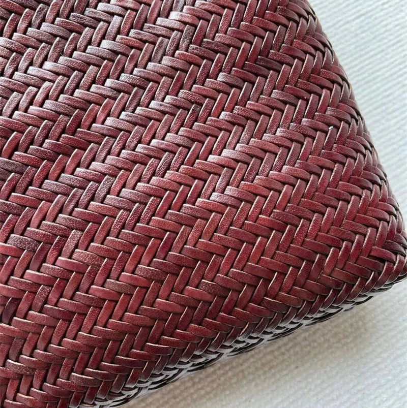 Brown handmade woven tote bag made of genuine cowhide leather with a three-dimensional pocket.