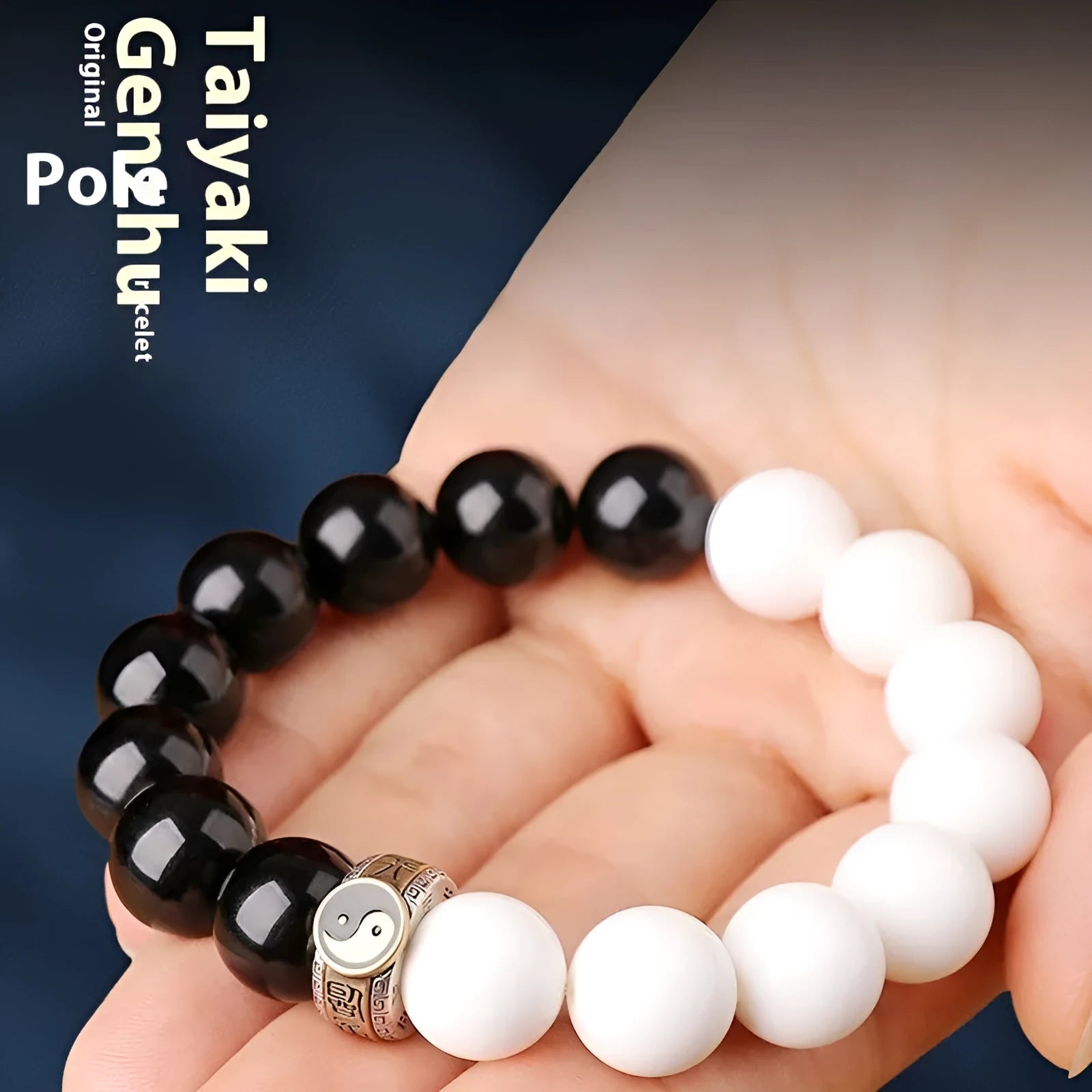 Black and white obsidian Tai Chi bracelet with geometric beads showing mantra inscriptions.