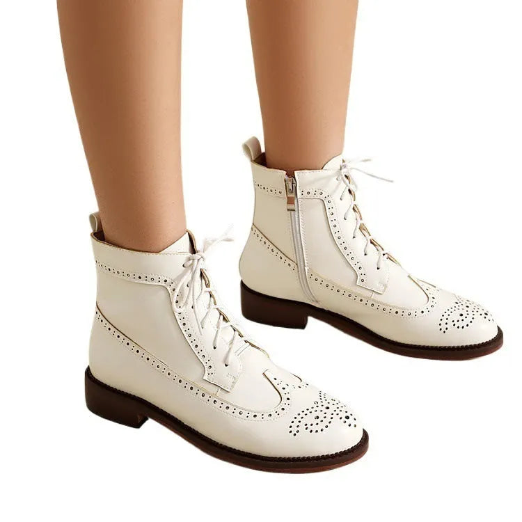 Women's black classic boots with chunky short stout heel, pointed toe, ethnic totem pattern, and middle calf length