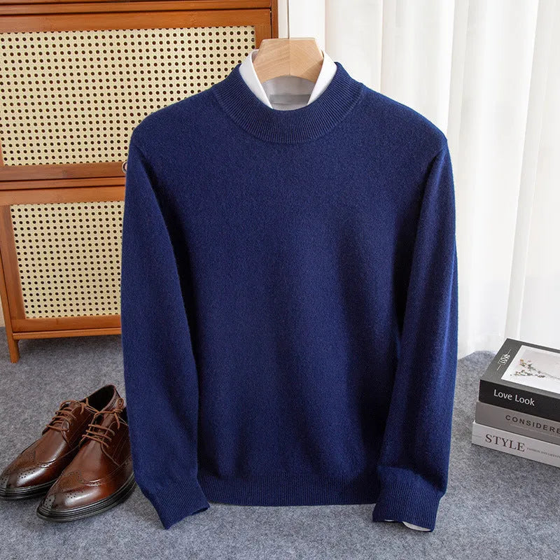 A man wearing a half-collar loose-fit wool sweater in a light business style, shown in a neutral colour.