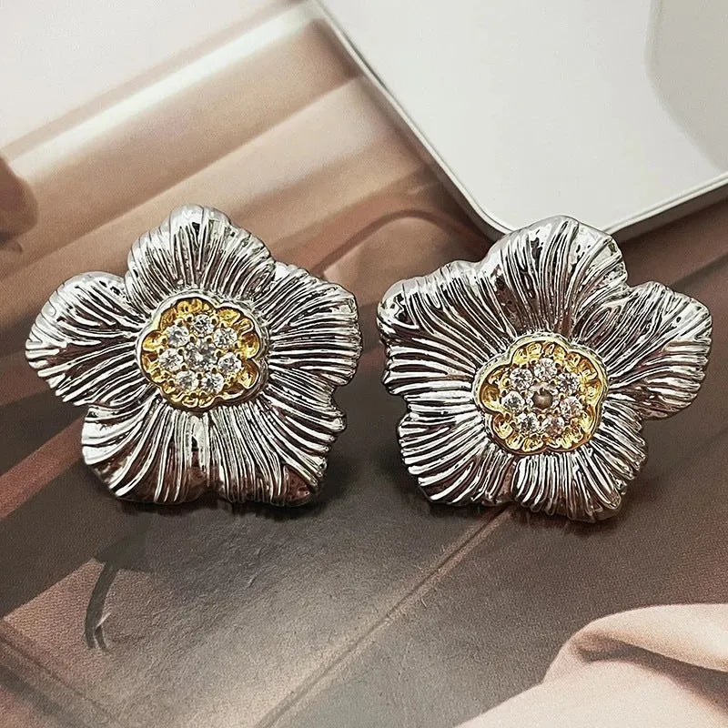 Retro textured gardenia stud earrings with two-tone electroplated finish on copper construction