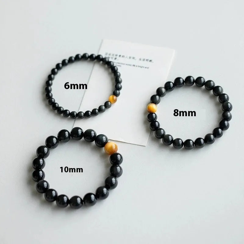 Black obsidian stone bracelet with geometric beads in Korean unisex style.
