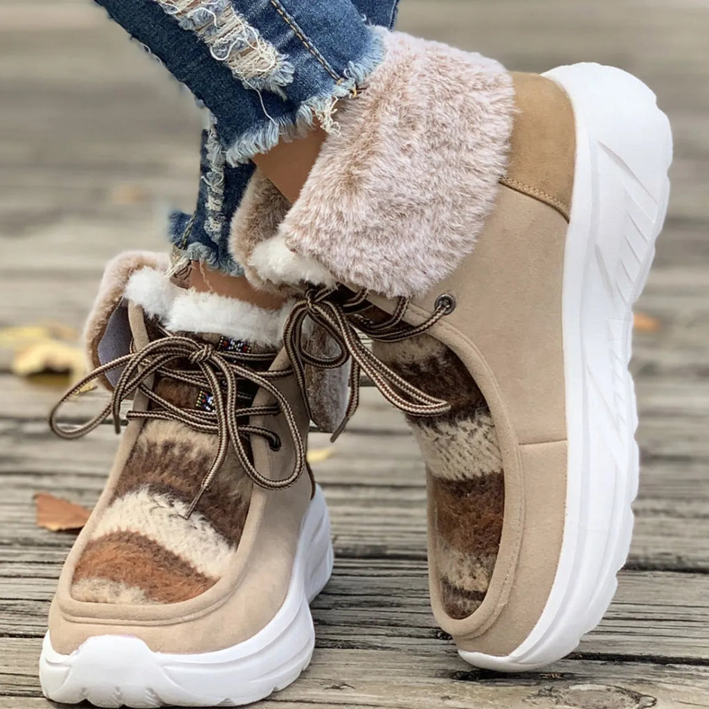 Women's beige fuzzy suede lace-up snow boots with thick rubber sole and plush lining.