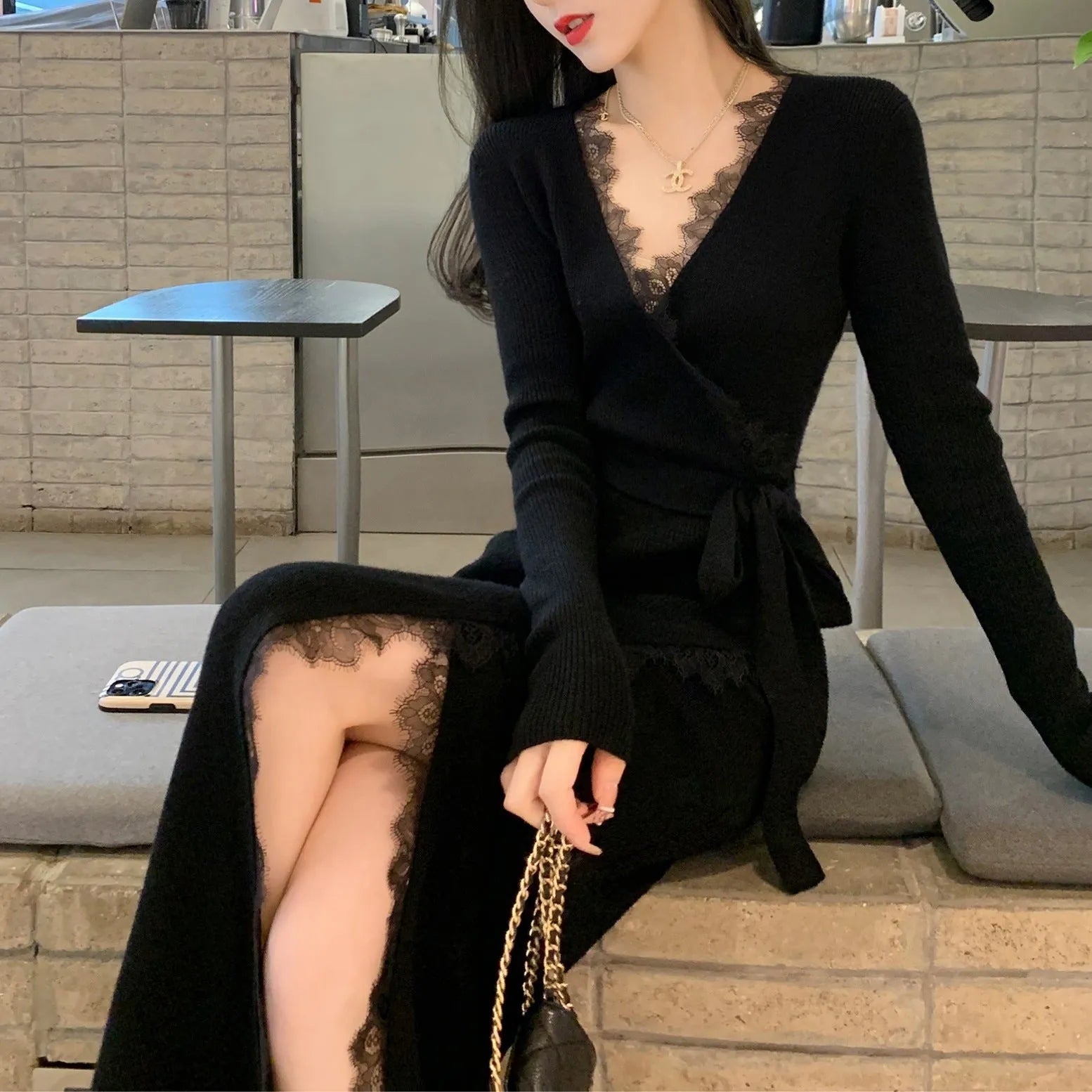 Black slim-fit women's formal skirt with a princess line silhouette on a hanger.