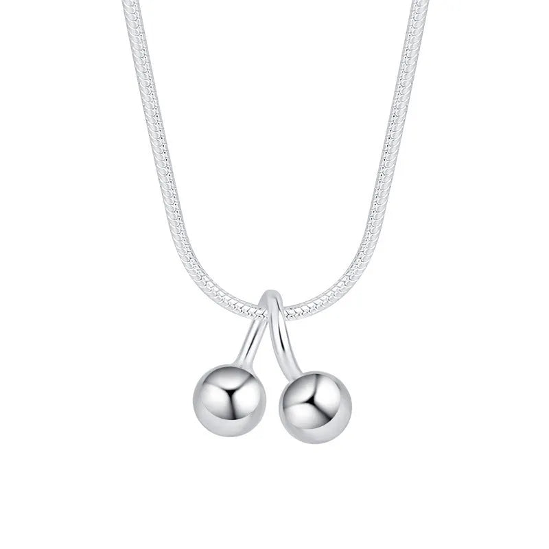 S925 silver cherry pendant necklace with adjustable snake bones chain on a white background.