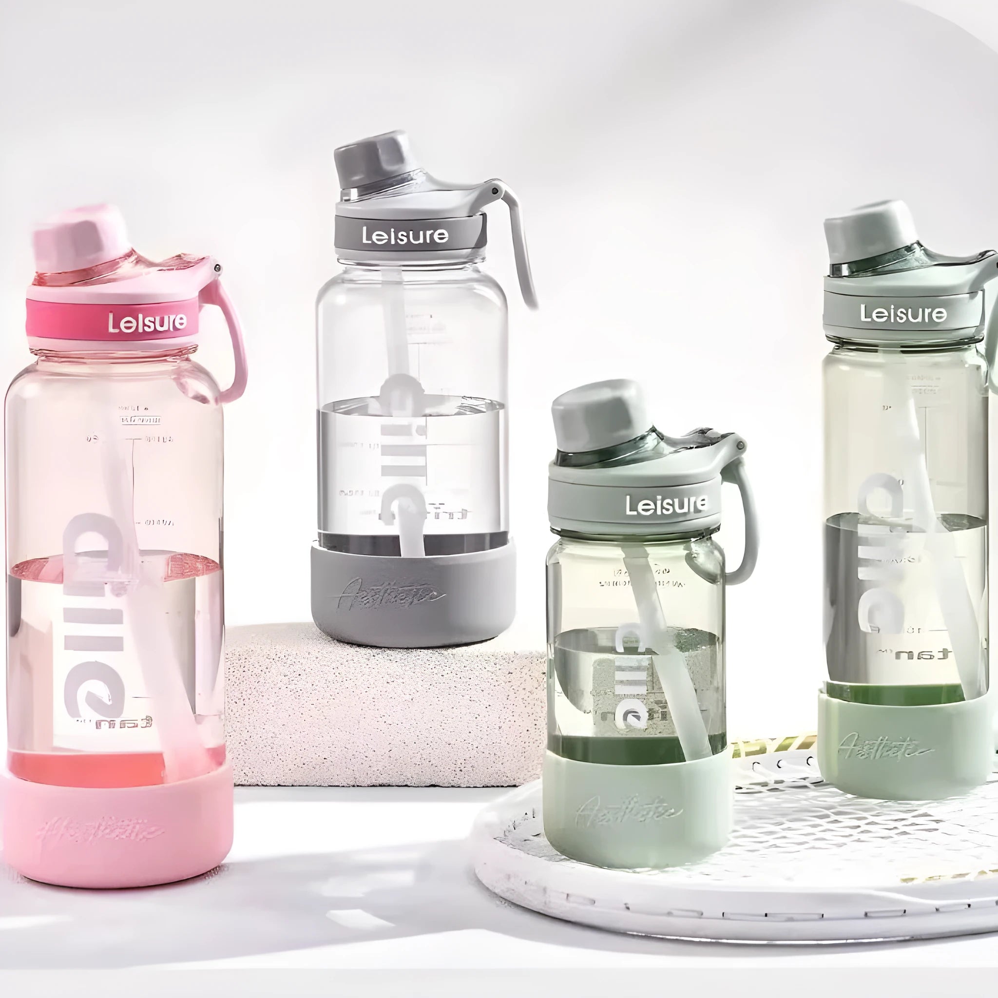Grey, green, and pink plastic cups with cartoon designs in 520ml, 780ml, and 1000ml sizes
