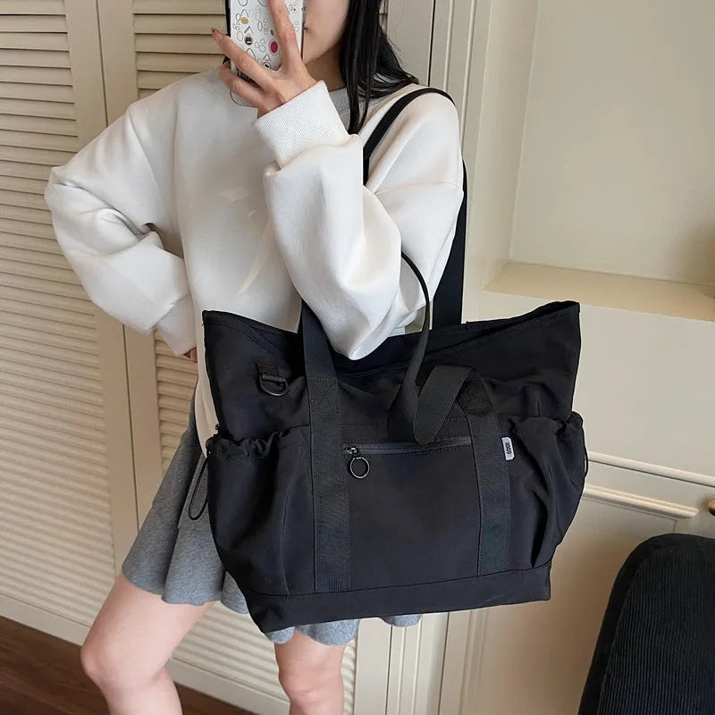 Women's lightweight Oxford cloth travel bag for yoga and fitness in grey colour with letter pattern