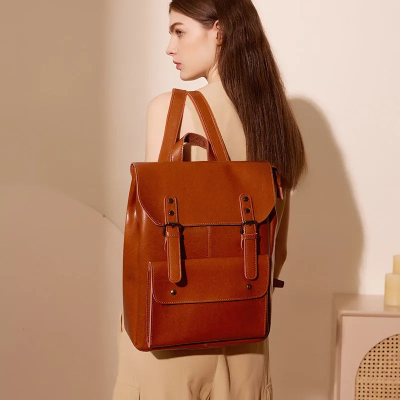 Hard cowhide leather computer backpack in black, brown, or coffee with lining cloth interior