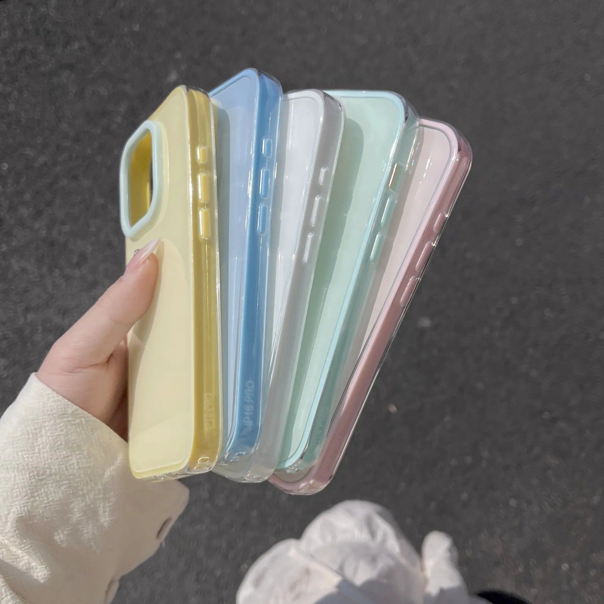 Solid colour transparent TPU jelly phone case for iPhone showing yellow, white, blue, pink, and green options