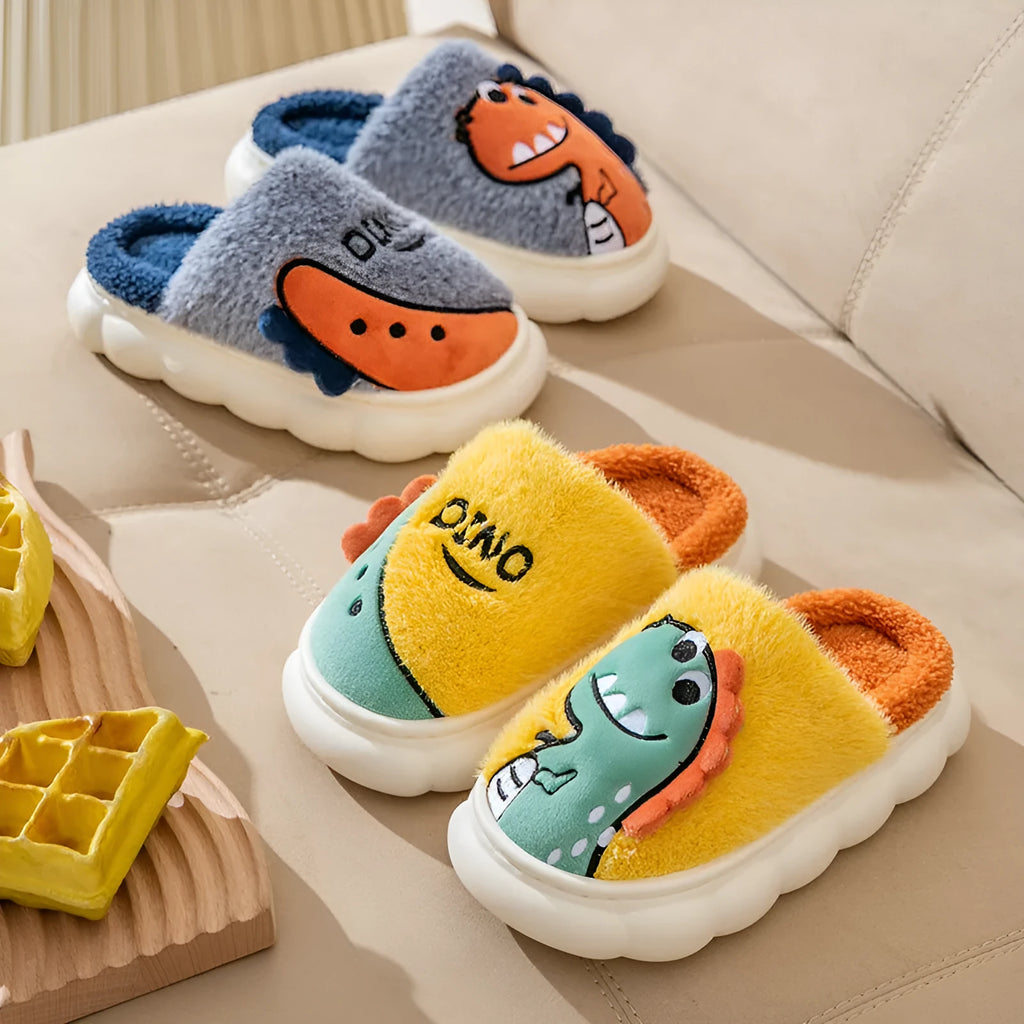 A pair of plush cotton couple slippers in a dinosaur colour theme, shown for indoor wear.