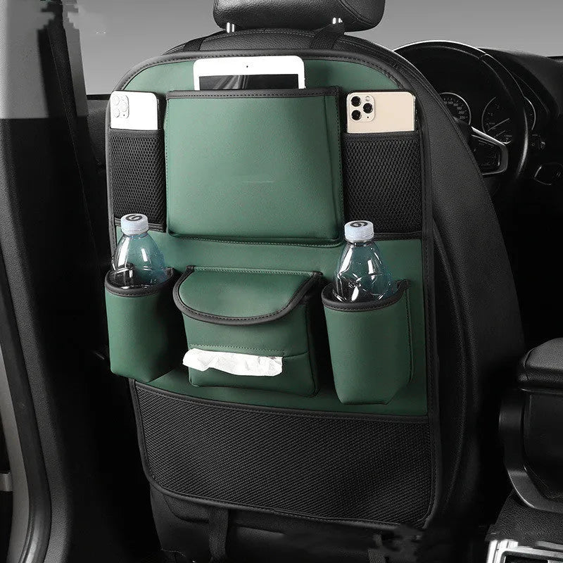 Black PU leather car seat back storage bag hanging on a grey car seat headrest.