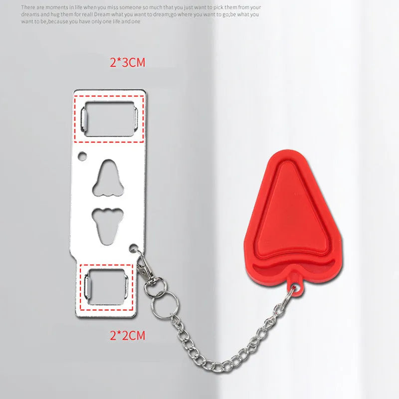 Red portable door safety latch lock with chrome-plated metal piece installed on a wooden door jamb