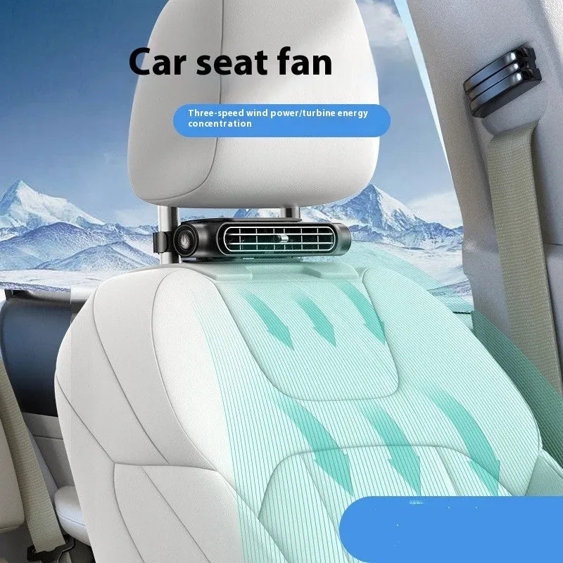 Compact black USB car fan with Velcro strap mounted on a car seat headrest.