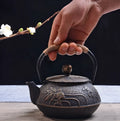 Cast iron teapot with Japanese patterns and 0.9 litre capacity