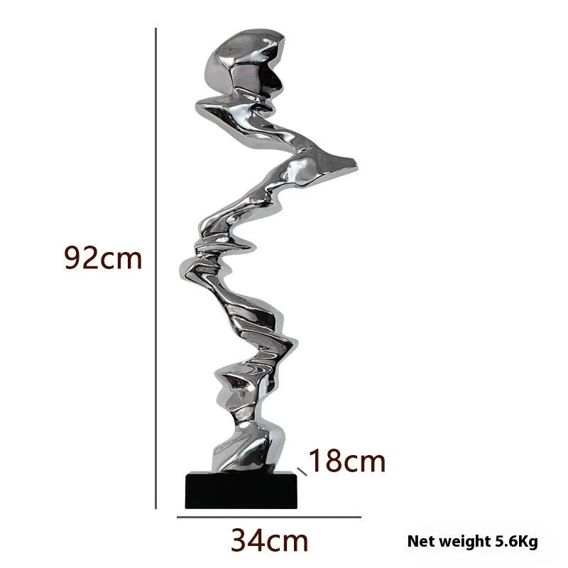 Abstract resin ornament in modern style with metallic finish for hallway or living room decoration