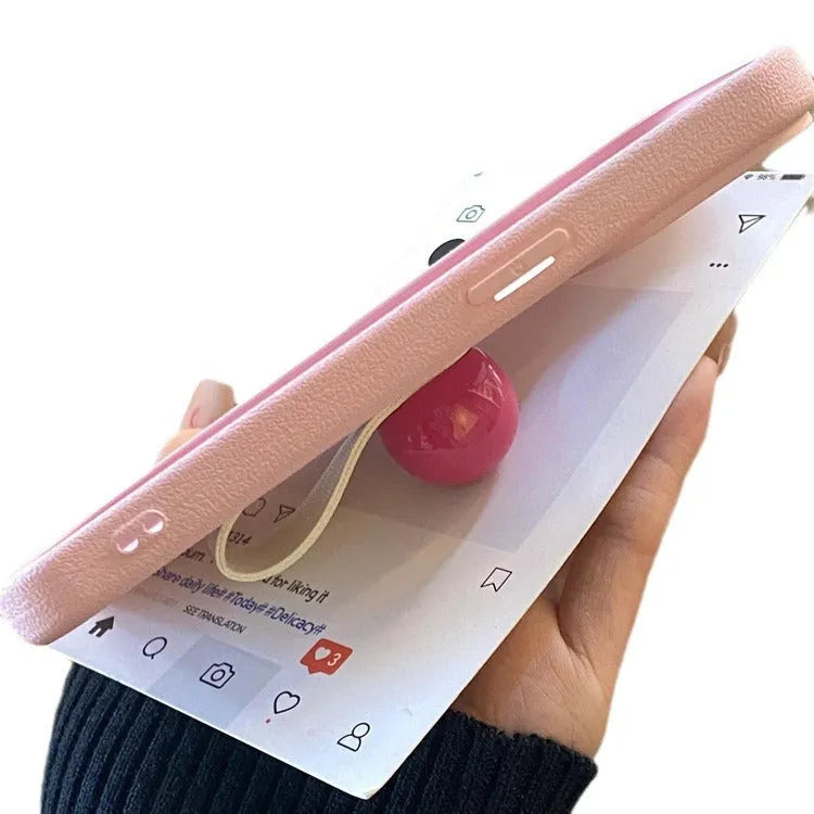 Polka dot silicone phone case with finger ring, frosted finish, for iPhone, pink colour, back view