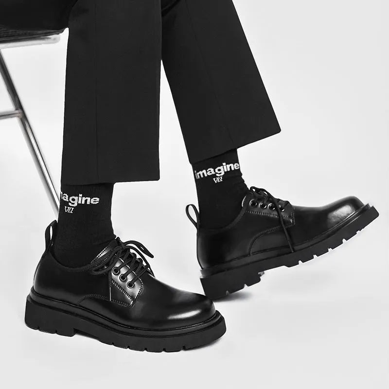 Men's black round-toe leather shoes with thick rubber sole and lace-up closure