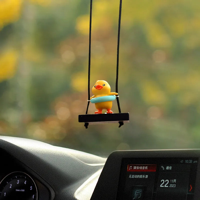 Yellow cartoon duck car hanging ornament in plastic, shown in four style variations.