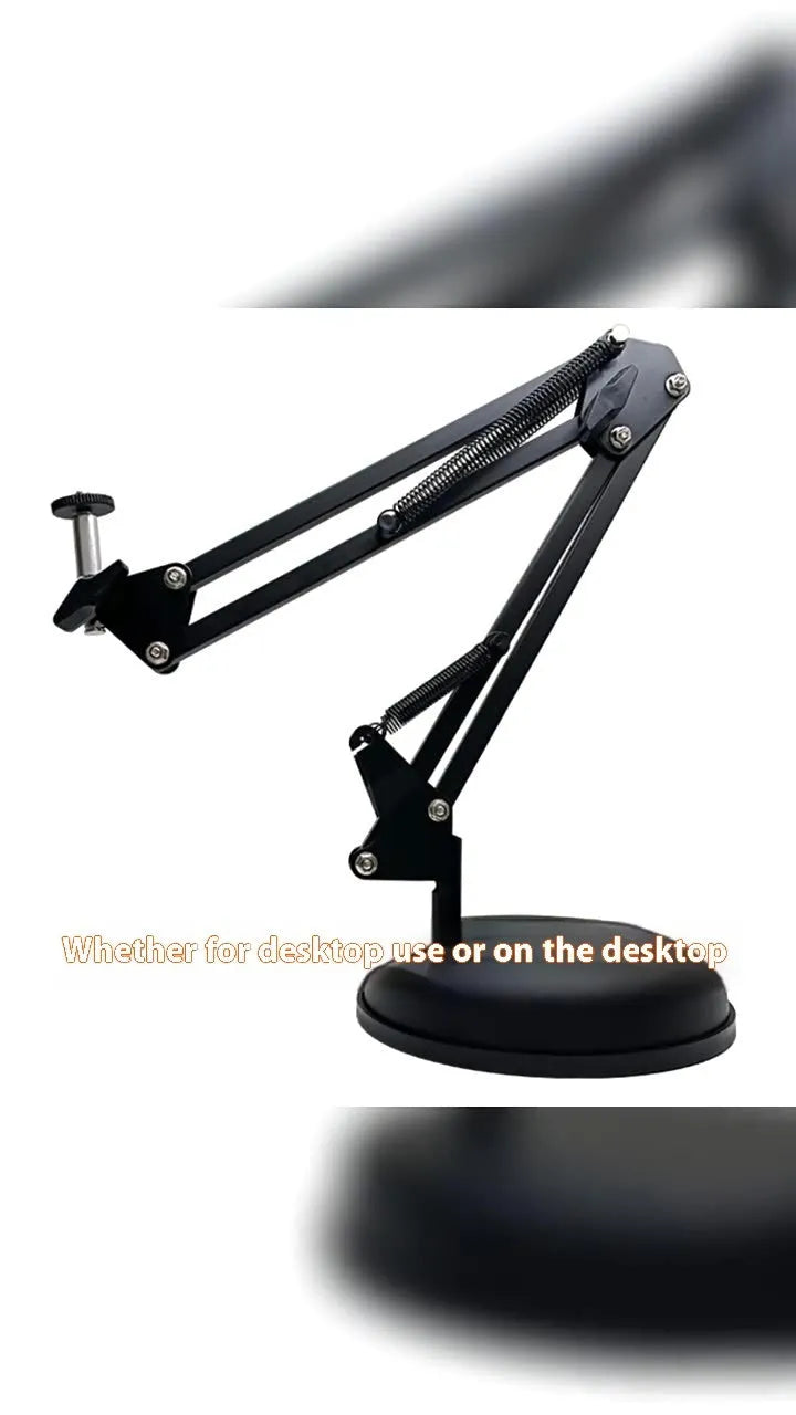 Black foldable metal cantilever bracket holding a tablet on a desktop, showing adjustable arms and clip.