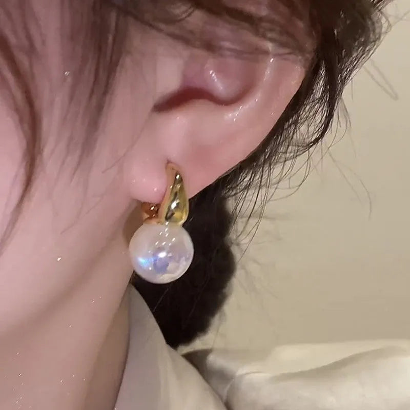 Mermaid pearl earrings for women with 14K gold finish and white pearl element