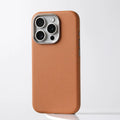 Black genuine leather iPhone case with metal camera lens guard showing Magsafe magnet ring