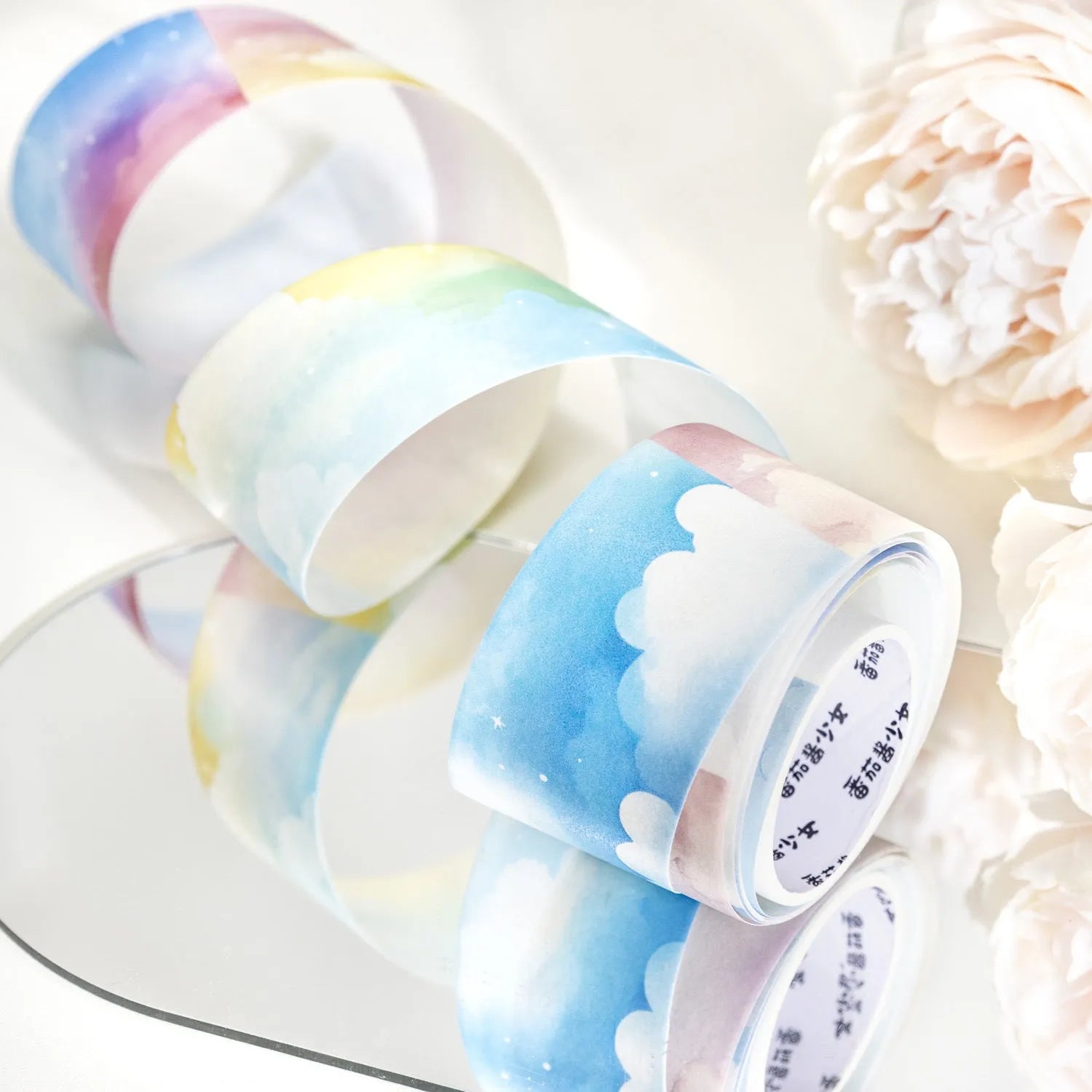 Japanese paper decorative tape roll with sky-themed designs including colourful clouds and purple nebulae