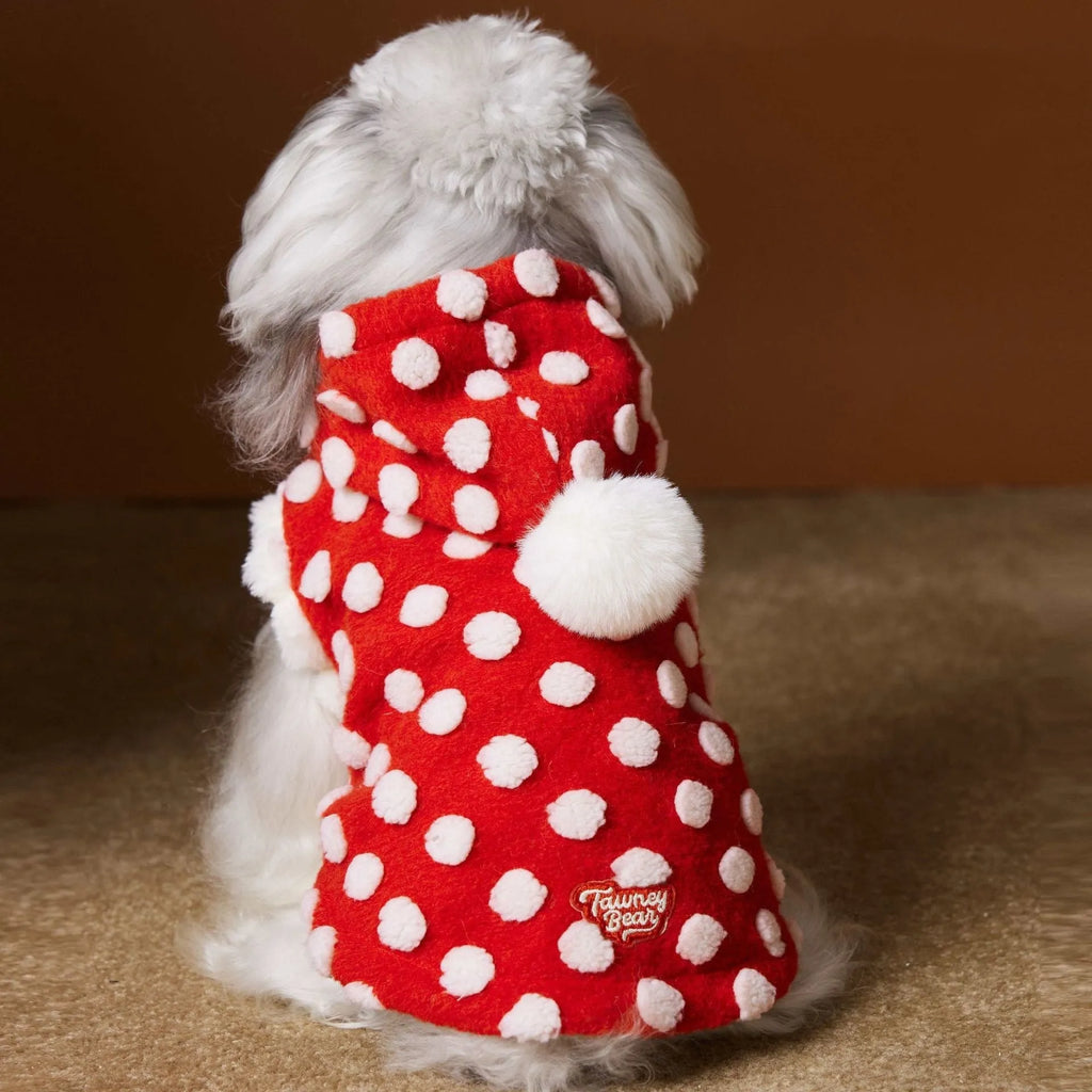 Red polka dot sleeveless hooded dog vest coat on a pet, front view, polyester fabric