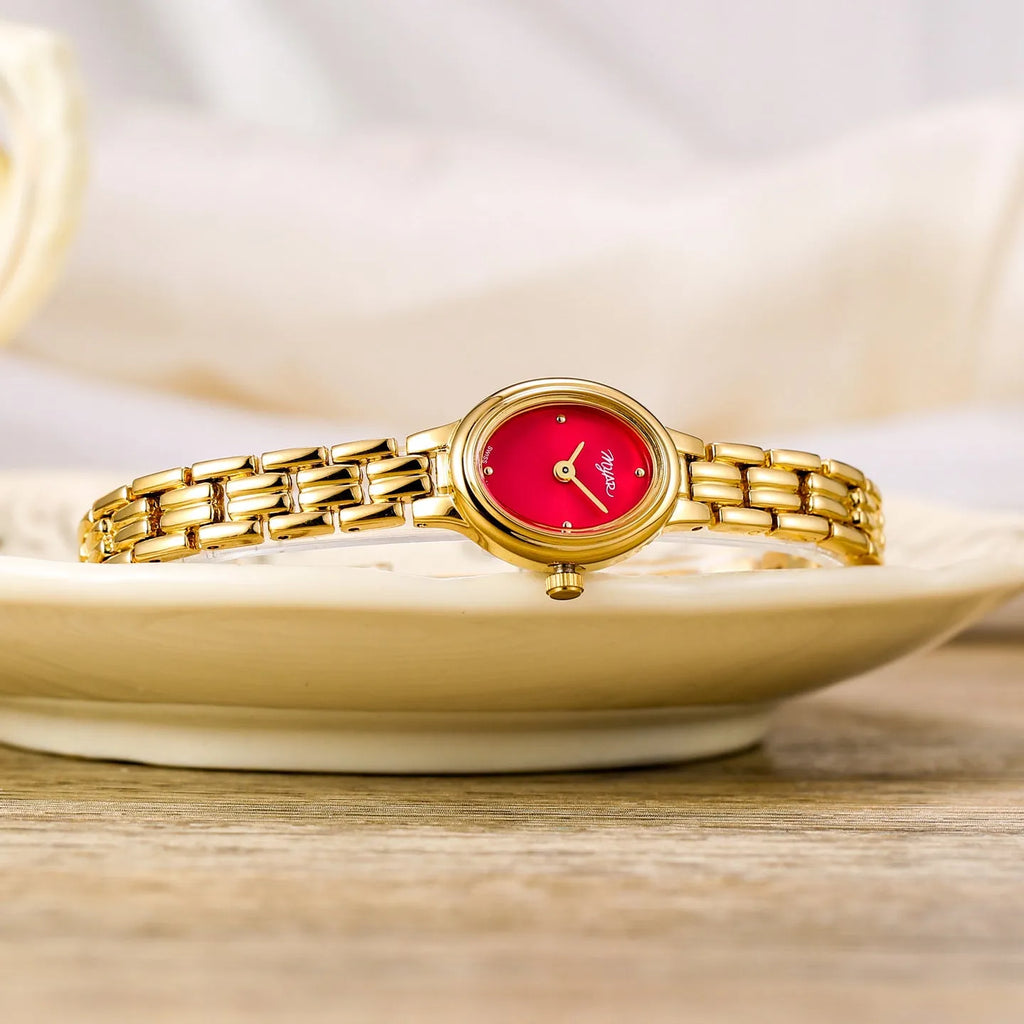 Oval mini women's vintage quartz watch with gold case, alloy strap, 30M water resistance, and 18mm x 22mm dial.