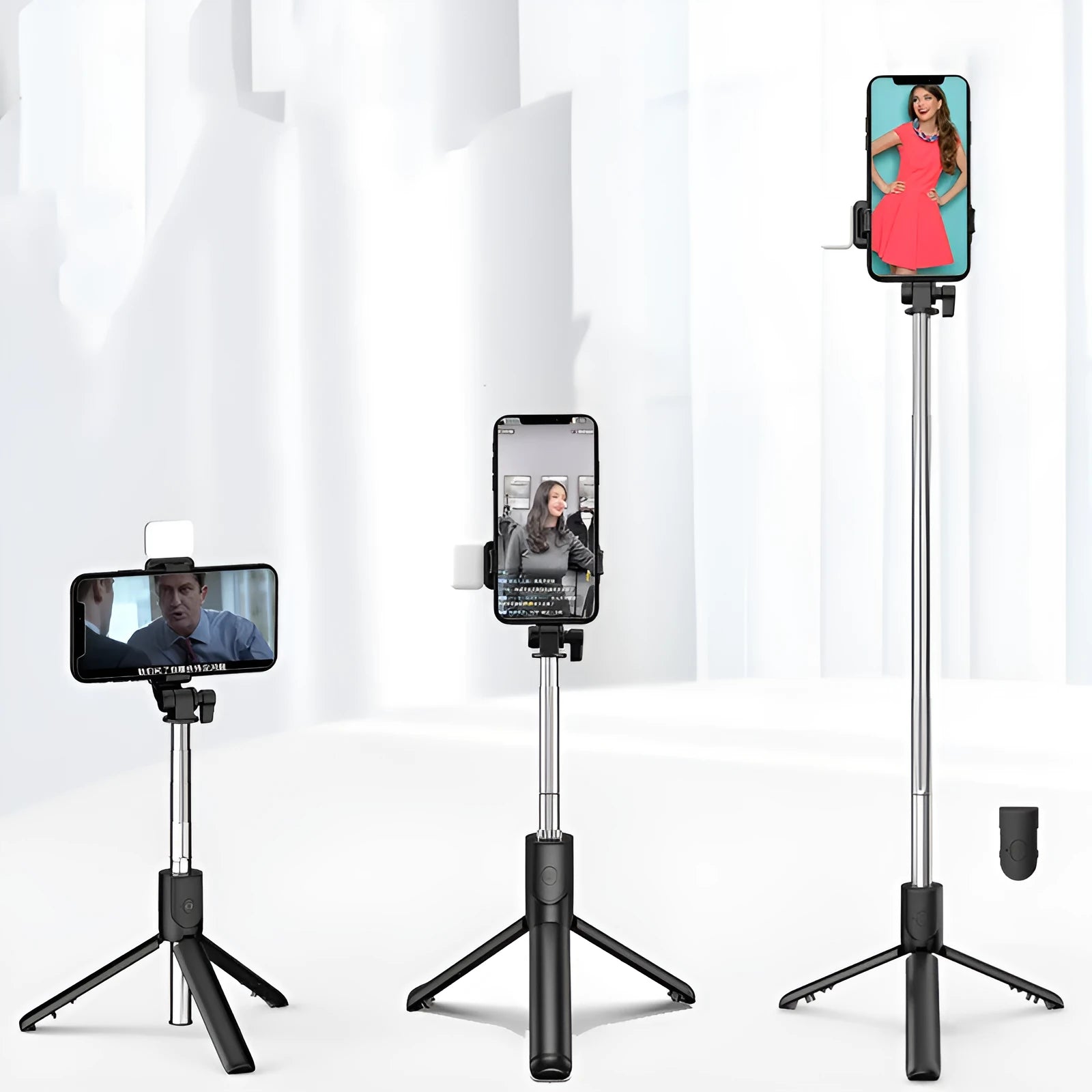 Black aluminium alloy Bluetooth selfie stick with extended tripod legs and a smartphone attached.