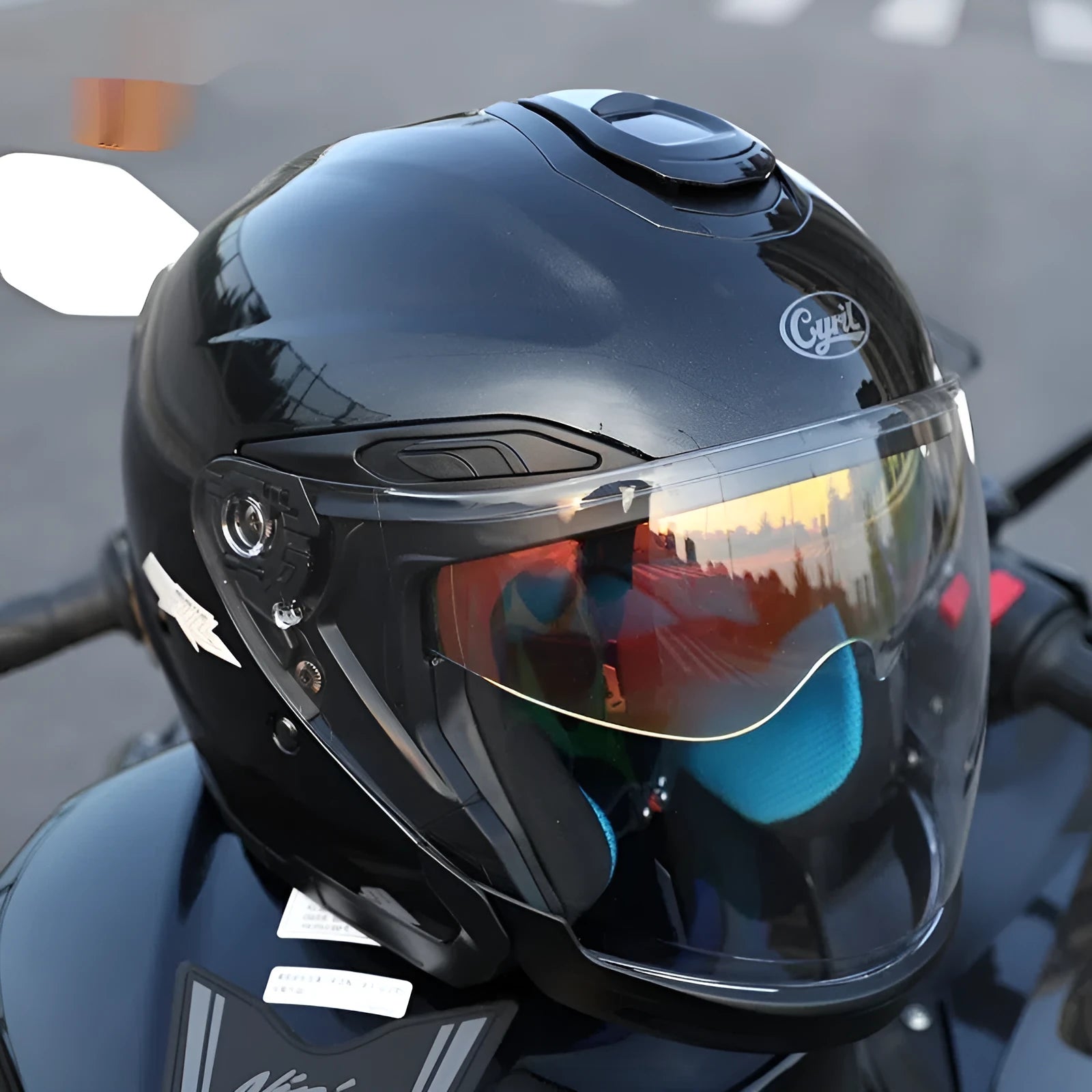Summer motorcycle half helmet with double visor in matte black finish on light background