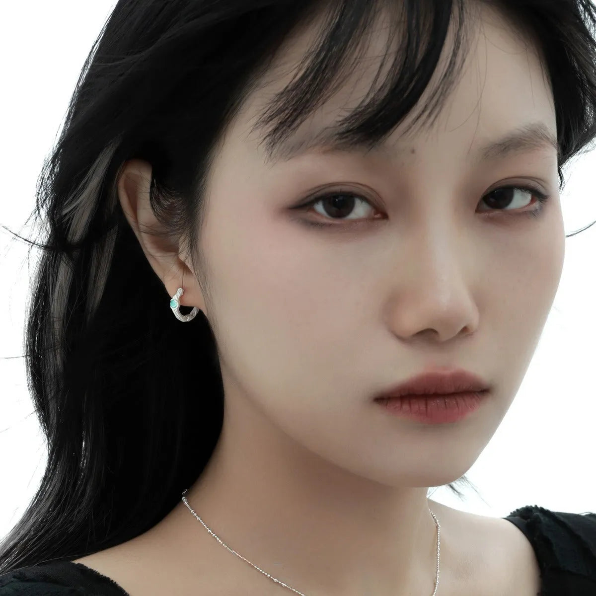 Female geometry round ear clip in burnt silver finish made from 925 silver