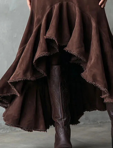 Brown women's high-low maxi skirt with a ruffle hem and textured eco suede finish.