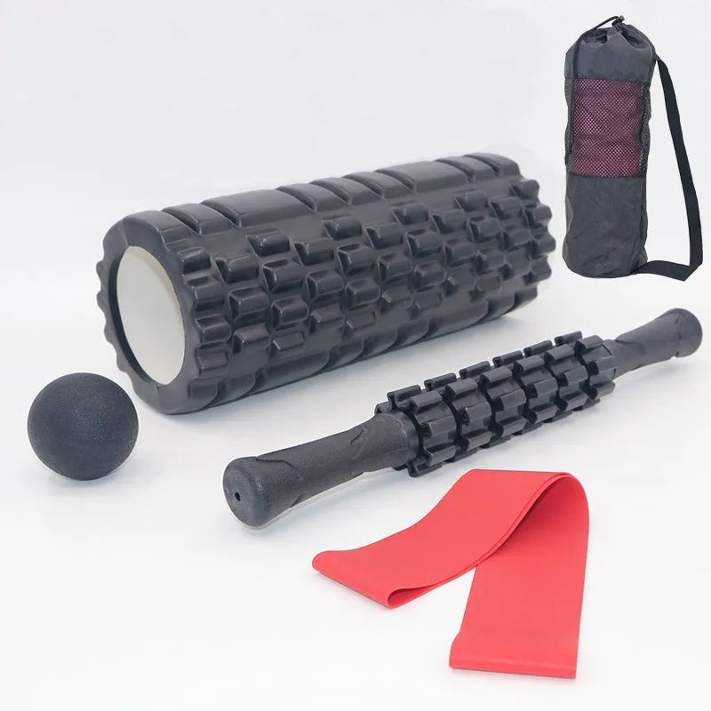 Black 33cm fitness foam roller and massage stick set on a grey background.