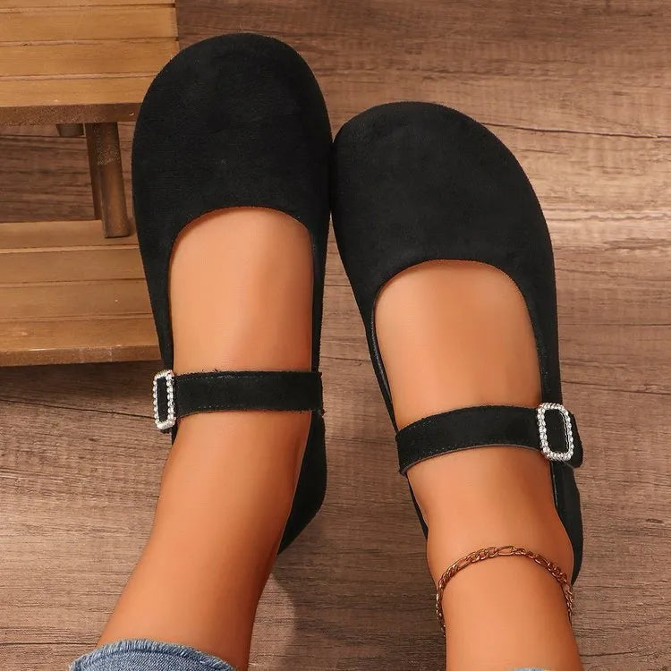 Women's solid black casual flat fisherman shoes with canvas upper and rubber sole.