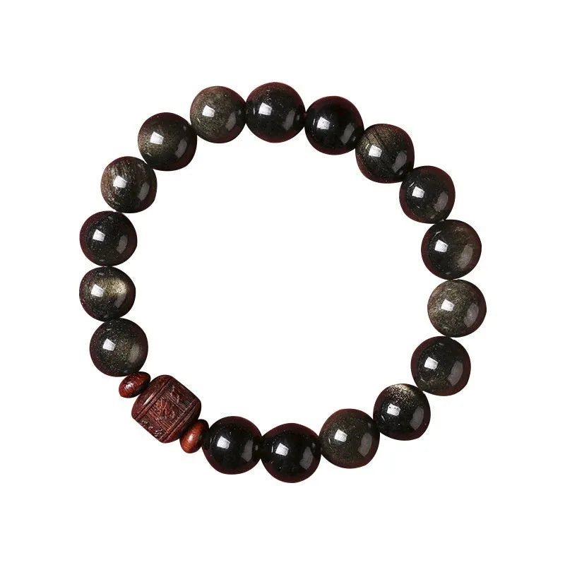 Close-up of a hand-woven Better Luck Beads bracelet with 10mm round Golden Obsidian beads in a retro style.