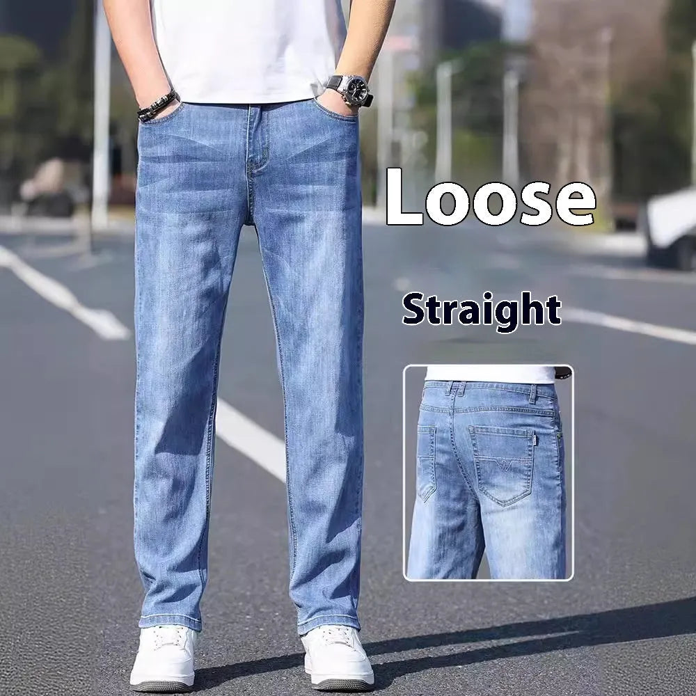 Tapered fit stretch denim trousers for business casual wear in light blue, grey, blue-grey, or black.